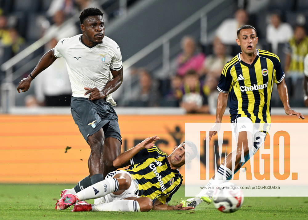 Fenerbahce v Lazio - Friendly match ISTANBUL, TURKIYE - JULY 30: Mert Muldur (ground) of Fenerbahce in action against Oluwafisayo Dele-Bashiru (L) of Lazio during a friendly match against Lazio at Chobani Stadium in Istanbul, Turkiye, on July 30, 2025. Ali Atmaca Anadolu Istanbul Turkey. Editorial use only. Please get in touch for any other usage.