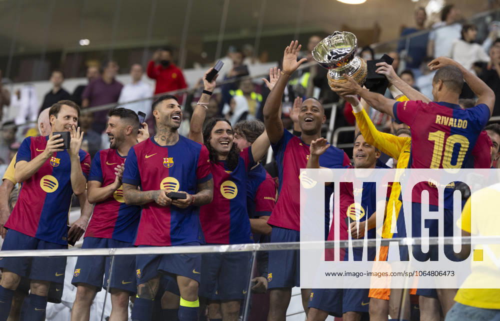 Legends of El Clasico: Real Madrid v Barcelona DOHA, QATAR - NOV 28: Barcelona s legends pose for a picture with the trophy after winning the Legends El Clasico football match between Real Madrid and Barcelona at the Khalifa International Stadium in Doha, Qatar on November 28, 2024. Doha Qatar. Editorial use only. Please get in touch for any other usage.