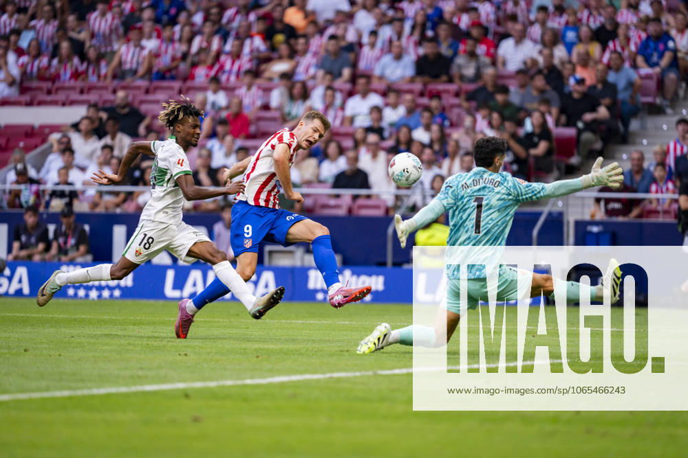 Atletico de Madrid v Elche CF - LaLiga EA Sports Alexander Sorloth of Atletico de Madrid (C) scores a goal between John Nwankwo (L) and Matias Dituro (R) of Elche CF during the LaLiga EA Sports football match between Atletico de Madrid and Elche CF at Estadio Riyadh Air Metropolitano on August 23, 2025 in Madrid, Spain. Madrid Estadio Riyadh Air Metropolitano Madrid Spain