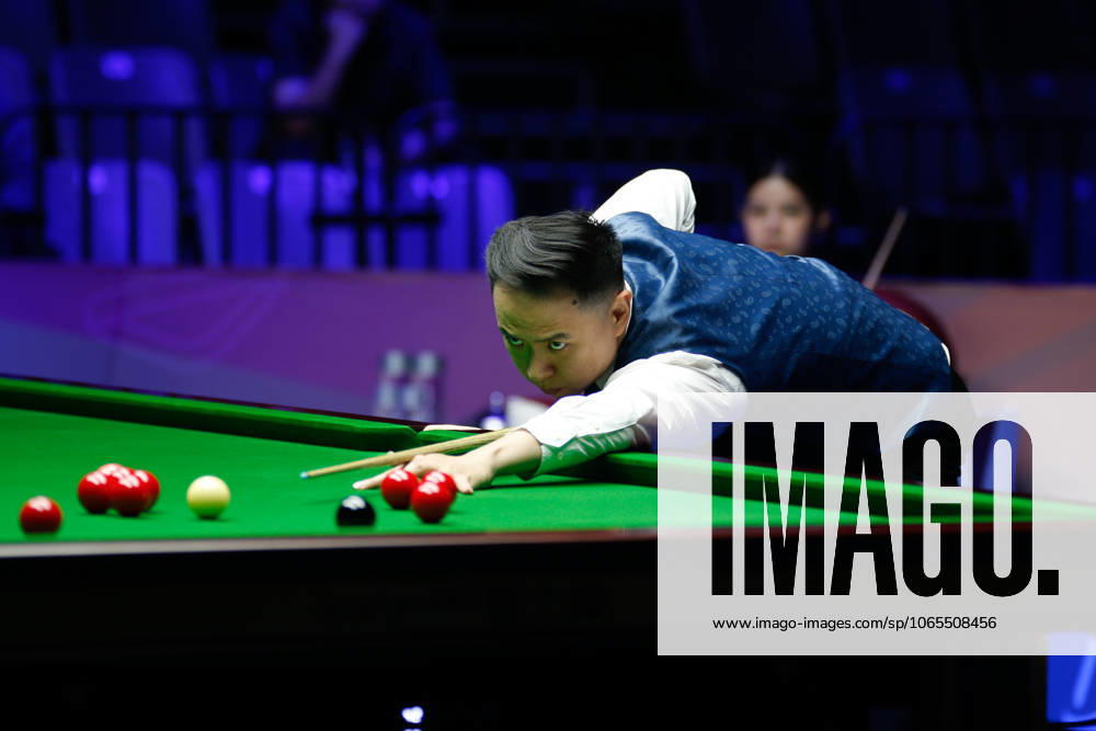 Xiao Guodong of China plays a shot in the first round match against Mink Nutcharut of Thailand on day 1 of the 2025 Wuhan Open Qualifiers at Optics Valley Gymnasium of HUST on August 24, 2025 in Wuhan, Hubei Province of China.