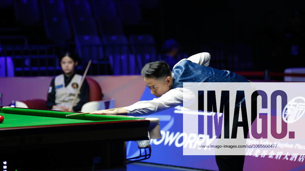 Xiao Guodong of China plays a shot in the first round match against Mink Nutcharut of Thailand on day 1 of the 2025 Wuhan Open Qualifiers at Optics Valley Gymnasium of HUST on August 24, 2025 in Wuhan, Hubei Province of China.