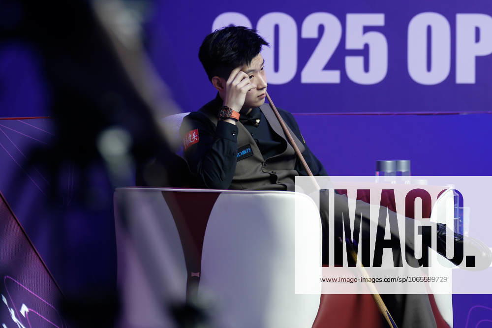 Zhao Xintong of China reacts in the third round match against Stephen Maguire of Scotland on day 3 of the 2025 Wuhan Open Qualifiers at Optics Valley Gymnasium of HUST on August 26, 2025 in Wuhan, Hubei Province of China.