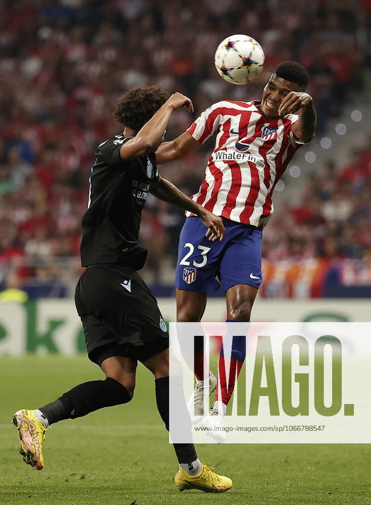 Atletico Madrid v Club Brugge - UEFA Champions League MADRID, SPAIN - OCTOBER 12: Atletico Madrid s player Reinildo Mandava (R) in action against Tajon Buchanan (L) of Club Brugge during the UEFA Champions League Group B football match between Atletico Madrid and Club Brugge at Civitas Metropolitano Stadium in Madrid, Spain on October 12, 2022. Madrid Spain. Editorial use only. Please get in touch for any other usage.