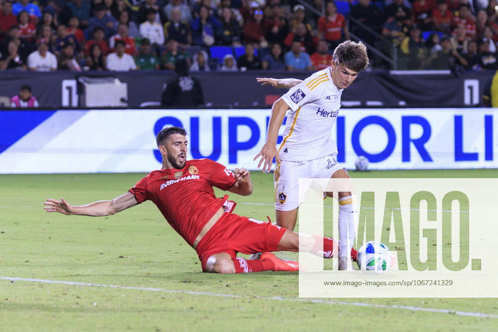 Paulinho 26 of Toluca FC attempts to slide tackle Harbor Miller 26 of the LA Galaxy during their 2025 Michelob ULTRA Campeones Cup match on Wednesday October 1, 2025 at the Dignity Health Sports Park in Carson, California. Toluca defeats Galaxy, 3-2. ARIANA RUIZ PI Carson USA - ZUMAp124 20251001_zaa_p124_074