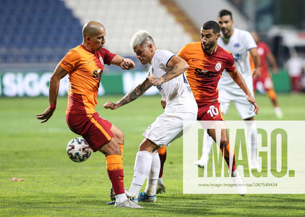 Kasimpasa v Galatasaray - Turkish Super Lig ISTANBUL, TURKEY - OCTOBER 4: Belhanda (R) and Feghouli (L) of Galatasaray in action against Sylvain Tirpan (24) of Kasimpasa during the Turkish Super Lig match between Kasimpasa and Galatasaray, at Recep Tayyip Erdogan Stadium on October 4, 2020 in Istanbul, Turkey. Istanbul Turkey. Editorial use only. Please get in touch for any other usage.