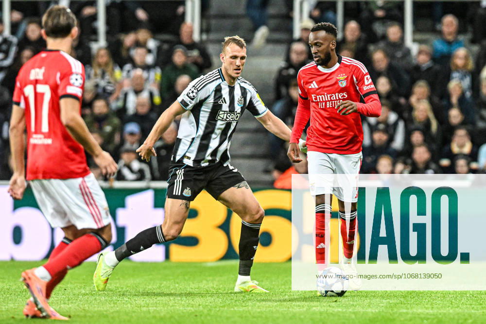 Newcastle United v Benfica UEFA Champions League Dodi Lukebakio of Benfica and Dan Burn of Newcastle United during the UEFA Champions League match at St. James s Park, Newcastle UK Newspapers OUT