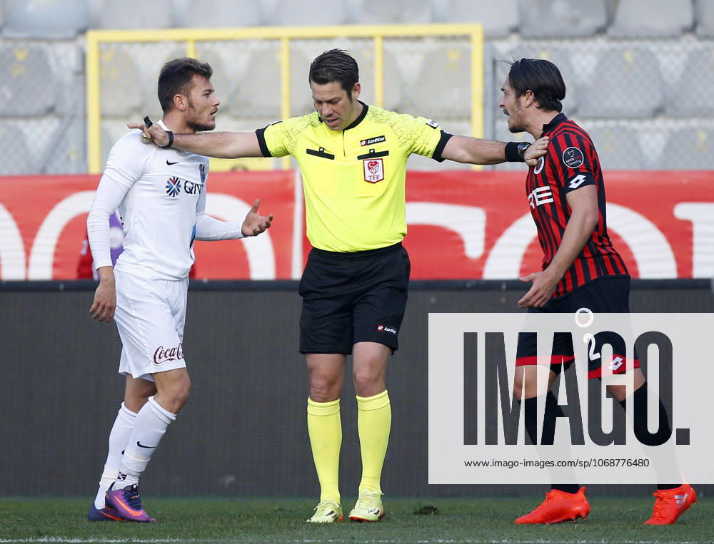 Genclerbirligi v Trabzonspor - Turkish Spor Toto Super Lig ANKARA, TURKEY - NOVEMBER 27: Yusuf Erdogan (L) of Trabzonspor reacts to Ahmet Oguz (R) of Genclerbirligi during the Turkish Spor Toto Super Lig football match between Genclerbirligi and Trabzonspor at the 19 May stadium in Ankara, Turkey on November 27, 2016. Ankara Turkey. Editorial use only. Please get in touch for any other usage.