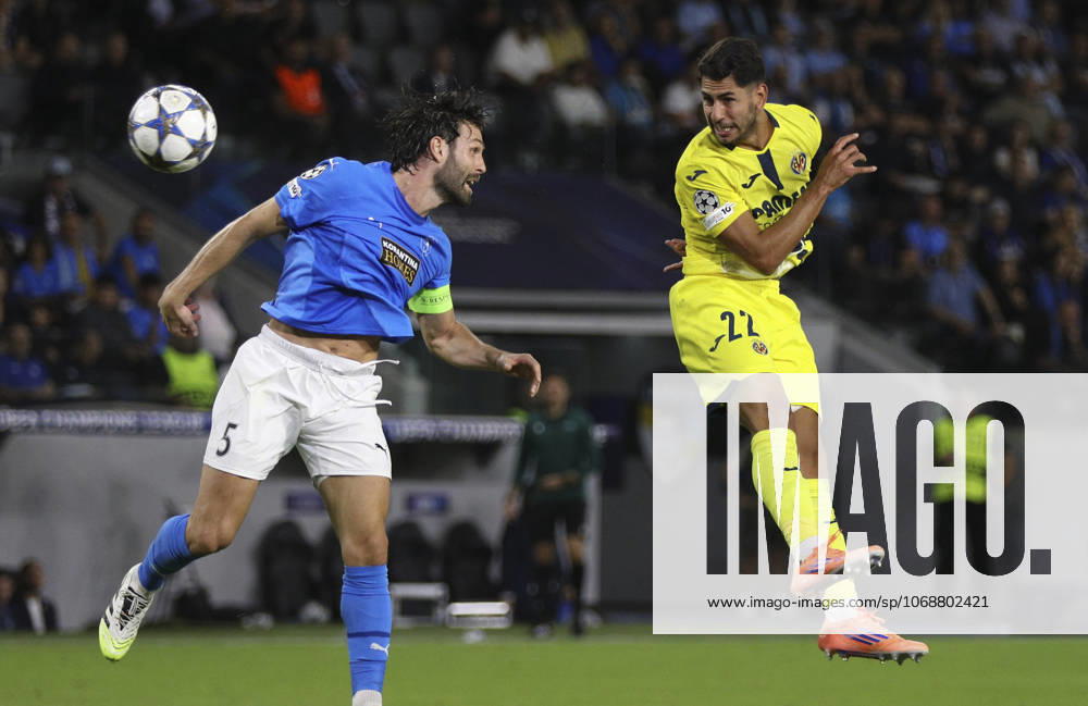 Cyprus Soccer Champions League Pafos David Goldar, left, and Villarreal s Santiago MouriAyos Perez jump for the ball during the Champions League opening phase soccer match between Pafos FC and Villarreal CF in Limassol, Cyprus, Wednesday, Nov. 4, 2025. Limassol Cyprus