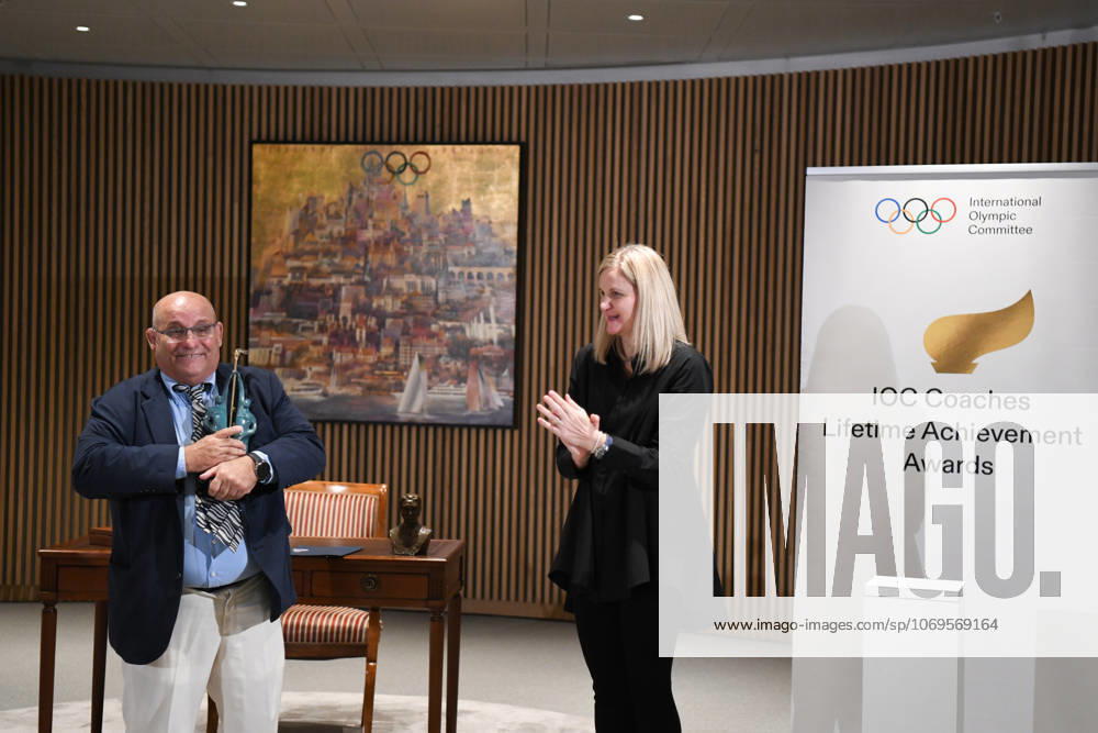 (251125) -- LAUSANNE, Nov. 25, 2025 -- IOC President Kirsty Coventry (R) applauds after handing the trophy of IOC Coaches Lifetime Achievement Award to Cuba s wrestling coach Raul de Jesus Trujillo Diaz at the Olympic House in Lausanne, Switzerland, Nov. 24, 2025. The International Olympic Committee (IOC) on Monday honored Chinese volleyball coach Lang Ping and Cuban wrestling coach Raul de Jesus Trujillo Diaz with the IOC Coaches Lifetime Achievement Awards. ) (SP)SWITZERLAND-LAUSANNE-2025 IOC COACHES LIFETIME ACHIEVEMENT AWARD LianxYi