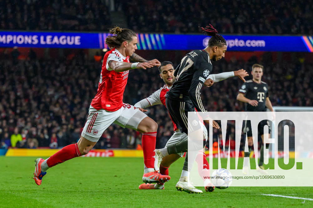 Arsenal v Bayern Munich Champions League 26 11 2025. Bayern Munich forward Michael Olise (17) under pressure from Arsenal midfielder Mikel Merino (23) and Arsenal defender Riccardo Calafiori (33) during the Champions League match between Arsenal and Bayern Munich at the Emirates Stadium, London, England on 26 November 2025. London Emirates Stadium Greater London England Editorial use only ,