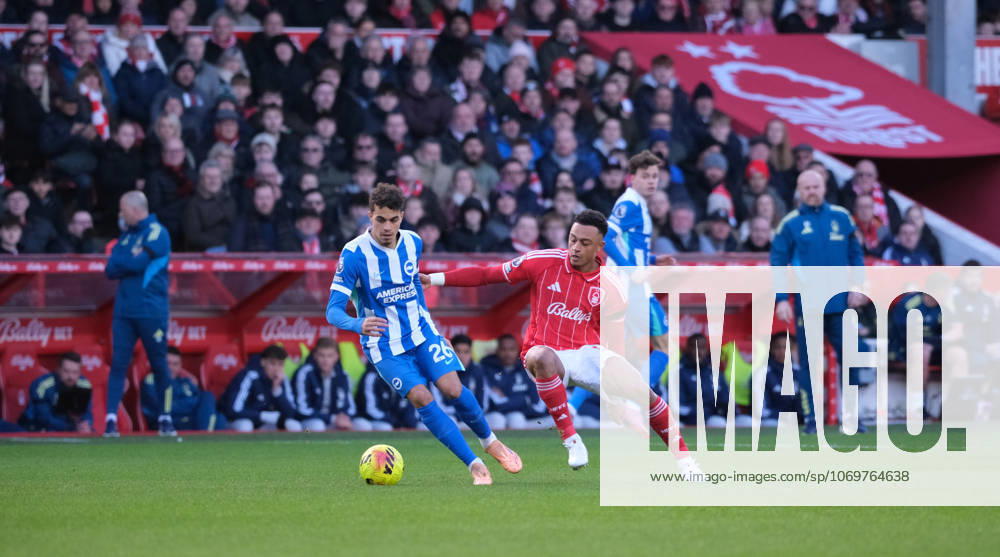 Yasin Ayari of Brighton & Hove Albion under pressure from Dan Ndoye of Nottingham Forest during the Premier league football match between Nottingham Forest and Brighton Hove Albion at City Ground in Nottingham.