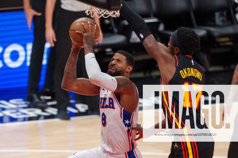 ATLANTA, GEORGIA - DECEMBER 14: Paul George 8 of the Philadelphia 76ers shoots the ball as Onyeka Okongwu 17 of the Atlanta Hawks defends in the third quarter during a game between Atlanta Hawks and Philadelphia 76ers at State Farm Arena on December 14, 2025, in Atlanta, Georgia. Atlanta United States - ZUMAt139 20251214_aaa_t139_071