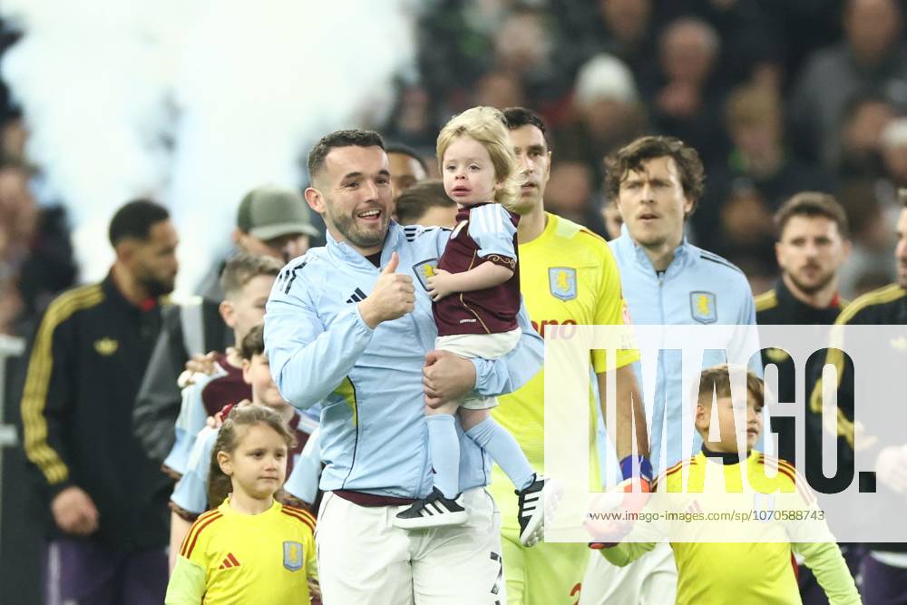 John McGinn of Aston Villa walks out with Sidney the grandson of Ozzie Osbourne. Aston Villa v Manchester United, ManU Premier League, Football, Villa Park, Birmingham, UK - 21 Dec 2025Birmingham Villa Park United Kingdom