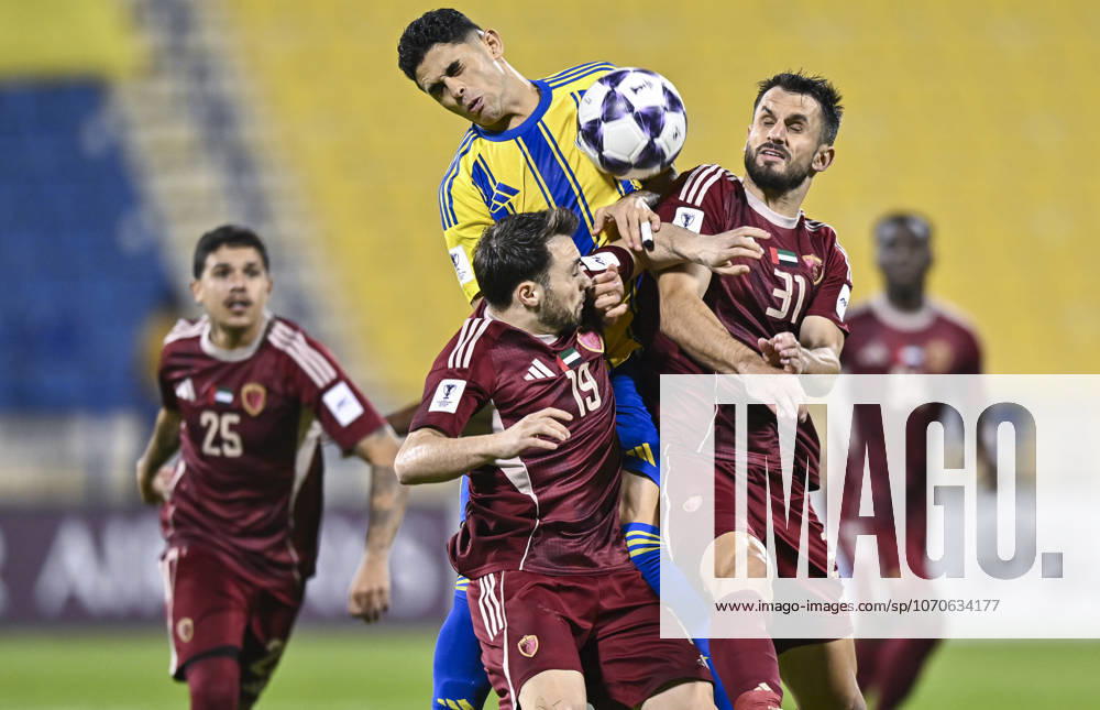 AFC CHAMPIONS LEAGUE ELITE, AL GHARAFA SC V AL WAHDA FC Jamal Hamed Mayor (C) of Al Gharafa SC and Sasa Ivkovic of Al Wahda FC in action during the AFC Champions League elite west football match between Qatar s Al Gharafa SC and United Arab Emirates Al Wahda FC at Thani Bin Jassim Stadium in Doha, Qatar on December 22, 2025. DOHA Qatar
