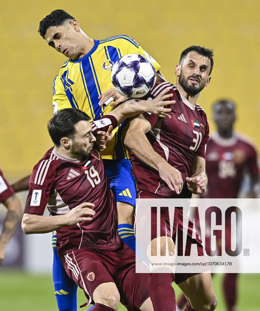 AFC CHAMPIONS LEAGUE ELITE, AL GHARAFA SC V AL WAHDA FC Jamal Hamed Mayor (C) of Al Gharafa SC and Sasa Ivkovic of Al Wahda FC in action during the AFC Champions League elite west football match between Qatar s Al Gharafa SC and United Arab Emirates Al Wahda FC at Thani Bin Jassim Stadium in Doha, Qatar on December 22, 2025. DOHA Qatar