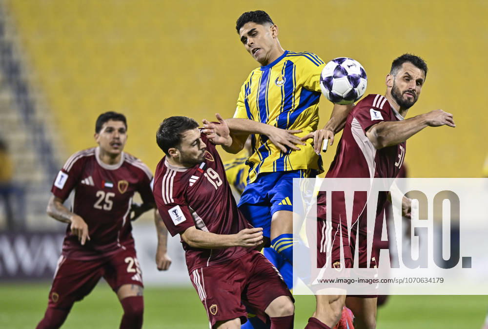 AFC CHAMPIONS LEAGUE ELITE, AL GHARAFA SC V AL WAHDA FC Jamal Hamed Mayor (C) of Al Gharafa SC and Sasa Ivkovic of Al Wahda FC in action during the AFC Champions League elite west football match between Qatar s Al Gharafa SC and United Arab Emirates Al Wahda FC at Thani Bin Jassim Stadium in Doha, Qatar on December 22, 2025. DOHA Qatar