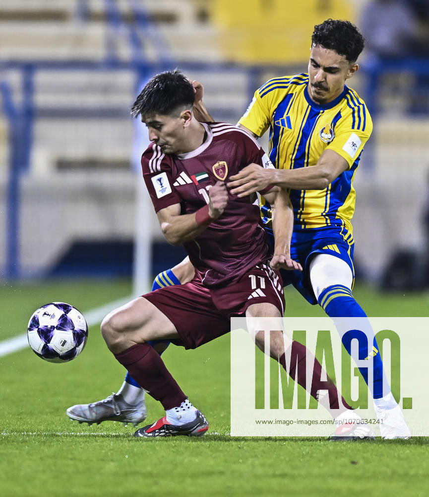 AFC CHAMPIONS LEAGUE ELITE, AL GHARAFA SC V AL WAHDA FC Ayoub Mohamed Aloui (R) of Al Gharafa SC and Facundo Kruspzky of Al Wahda FC in action during the AFC Champions League elite west football match between Qatar s Al Gharafa SC and United Arab Emirates Al Wahda FC at Thani Bin Jassim Stadium in Doha, Qatar on December 22, 2025. DOHA Qatar