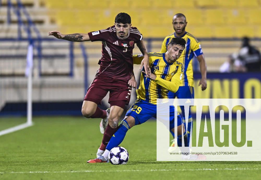 AFC CHAMPIONS LEAGUE ELITE, AL GHARAFA SC V AL WAHDA FC Fabricio Diaz Badaracco (L) of Al Gharafa SC and Lucas Pimenta of Al Wahda FC in action during the AFC Champions League elite west football match between Qatar s Al Gharafa SC and United Arab Emirates Al Wahda FC at Thani Bin Jassim Stadium in Doha, Qatar on December 22, 2025. DOHA Qatar
