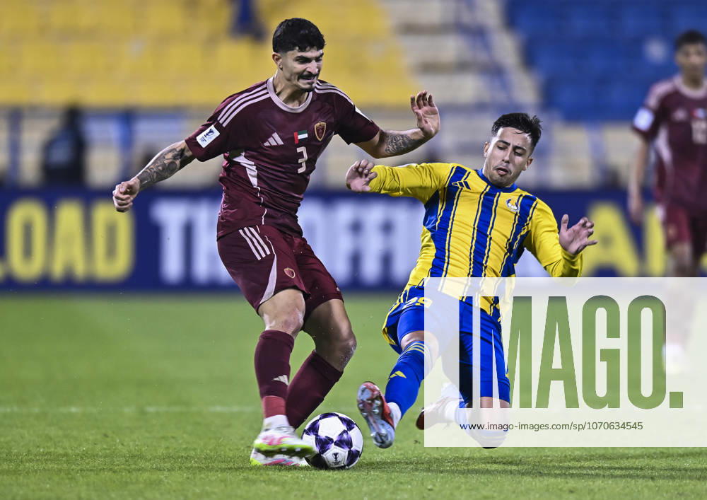 AFC CHAMPIONS LEAGUE ELITE, AL GHARAFA SC V AL WAHDA FC Fabricio Diaz Badaracco (R) of Al Gharafa SC and Lucas Pimenta of Al Wahda FC in action during the AFC Champions League elite west football match between Qatar s Al Gharafa SC and United Arab Emirates Al Wahda FC at Thani Bin Jassim Stadium in Doha, Qatar on December 22, 2025. DOHA Qatar