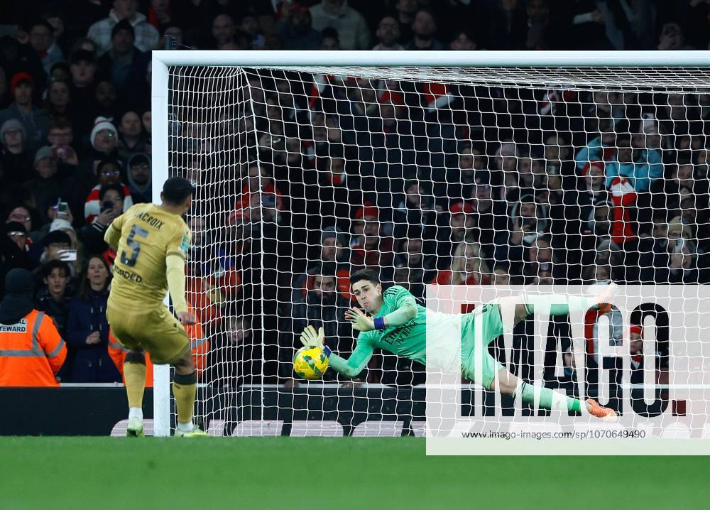 Kepa Arrizabalaga the Arsenal goalkeeper saves the match winning penalty from Maxence Lacroix of Crystal Palace in the penalty shoot out Arsenal v Crystal Palace, Football,Carabao Cup, Emirates Stadium, London, UK - 23 12 25 No use with unauthorised audio, video, data, fixture lists (outside the EU), club league logos or live services. Online in-match use limited to 45 images (+15 in extra time). No use to emulate moving images. No use in betting, games or