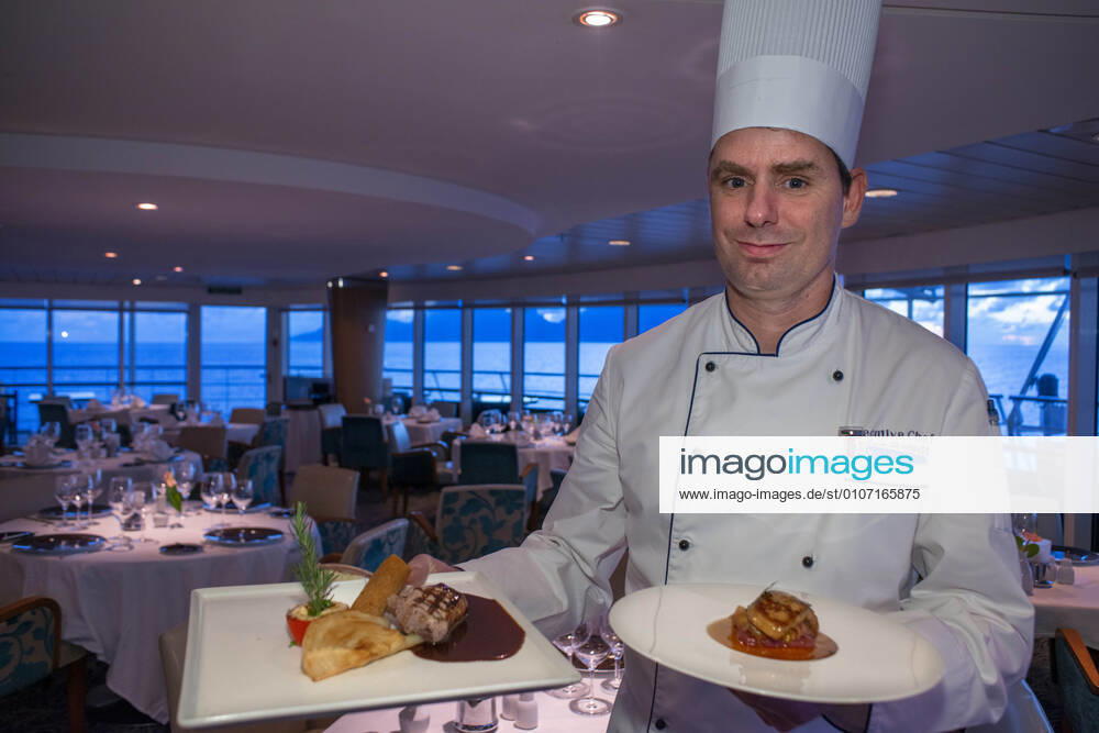 Stefan Berndt, the executive chef of Paul Gauguin show some dishes of the restaurant, 2-star Michelin. Paul Gauguin cruise, Society Islands, Tuamotus Archipelago, French Polynesia, South Pacific. French Polynesia