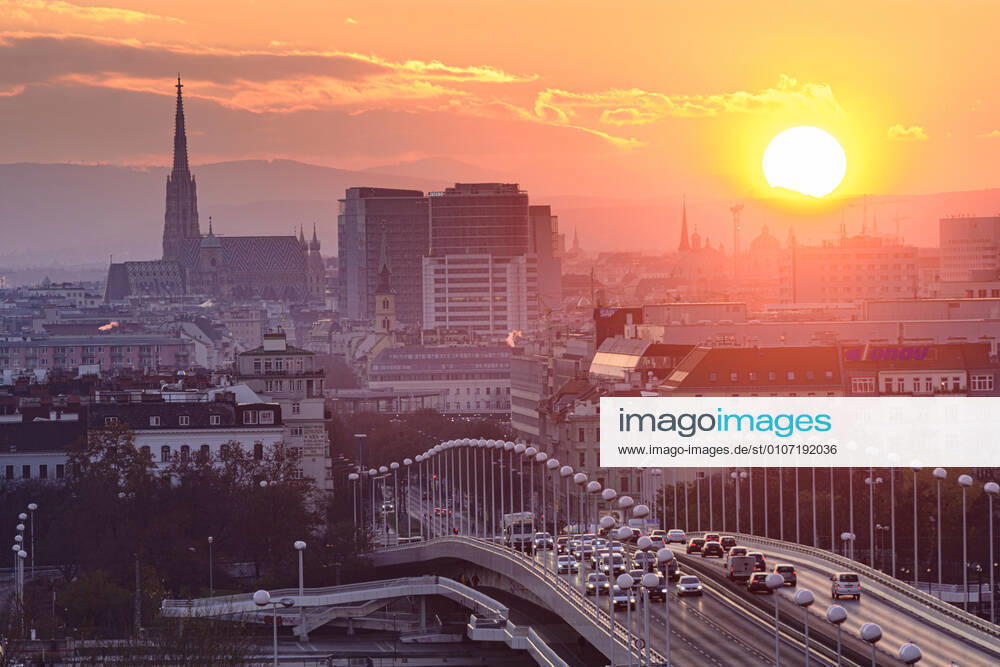 Vienna city center, river Donau (Danube), bridge Reichsbrücke, cathedral Stephansdom, sunset Wien, Vienna Wien Austria 00. overview