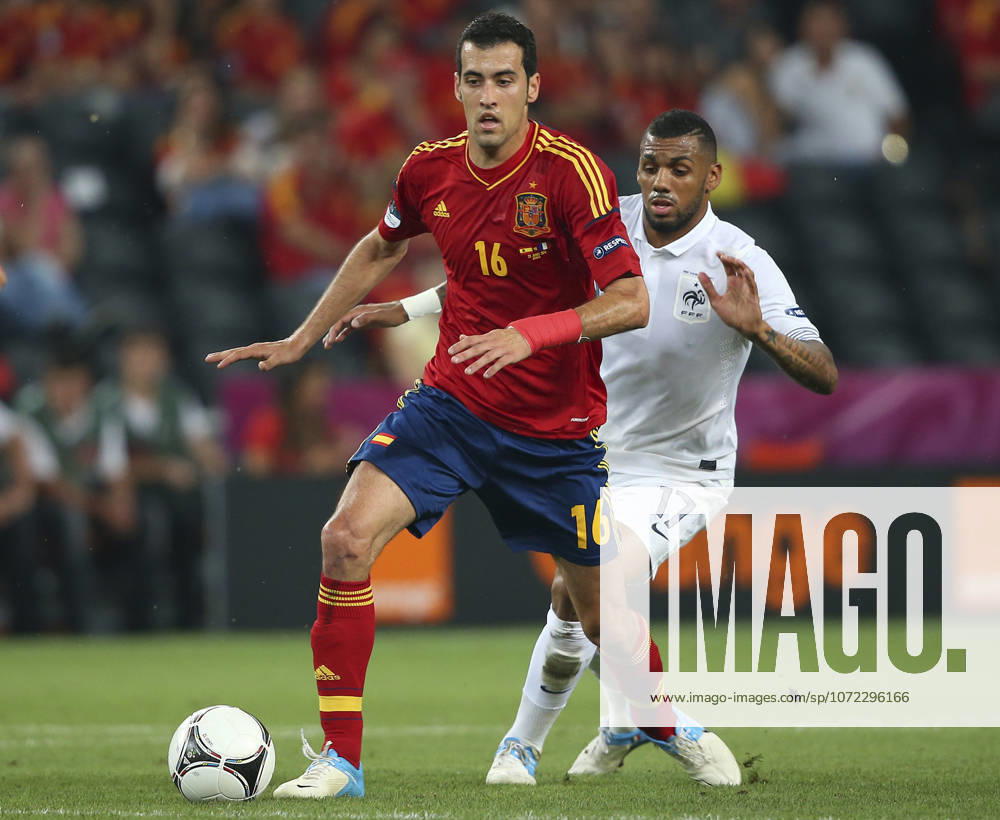 Spain V France, UEFA EURO, EM, Europameisterschaft,Fussball 2012 Quarter Final Sergio Busquets of Spain and Yann M Vila of France challenge during the UEFA Euro 2012 Quarter Final match between Spain and France at Donbass Arena on June 23, 2012 in Donetsk, Ukraine. Donetsk Donbass Arena Ukraine Ukraine