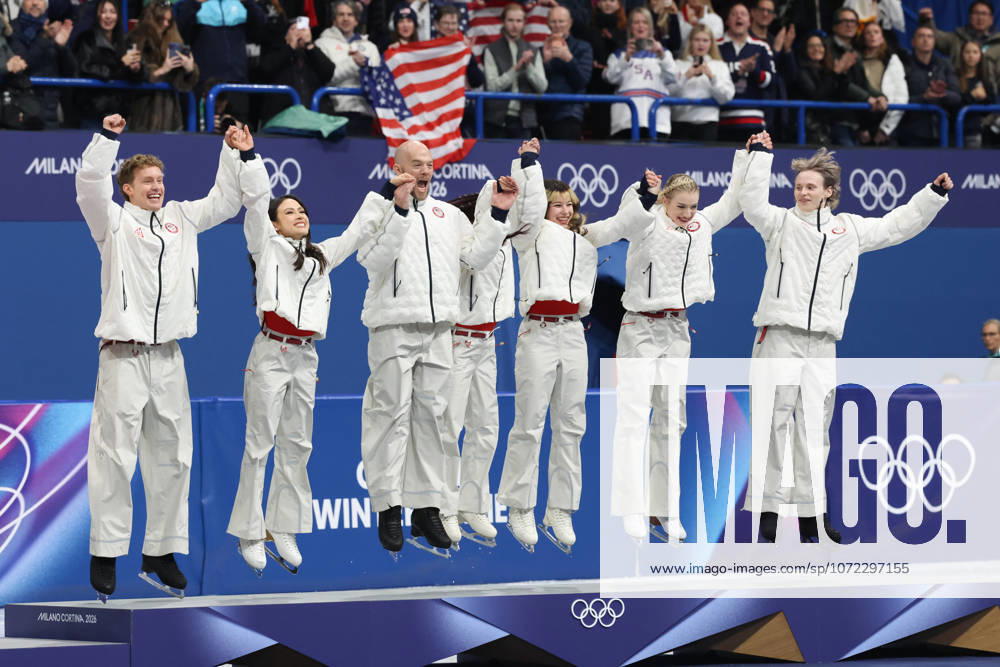 EVAN BATES, MADISON CHOCK, DANNY O SHEA, ELLIE KAM, ALYSA LIU, AMBER GLENN and ILIA MALININ of Team USA jump to celebrate winning the gold medal during the Victory Ceremony of the Figure skating, Eiskunstlauf Team Event at the Milano Cortina 2026 Winter Olympic Games, Olympische Spiele, Olympia, OS Olympics 2026: Milano Cortina: Figure Skating Team Event - ZUMAc179 20260208_oly_c179_095