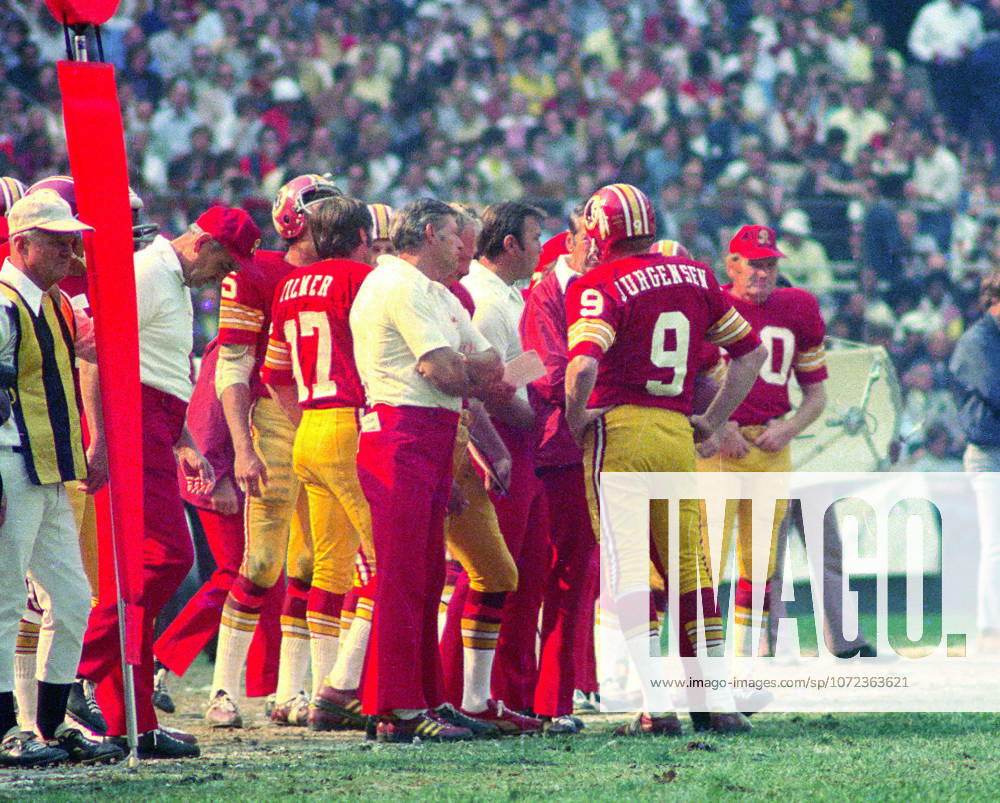 Washington Redskins quarterback Sonny Jurgensen 9 discusses strategy during the game against the Miami Dolphins at RFK Stadium in Washington, DC on October 13, 1974. The Redskins won the game 20 - 17 Washington USA - ZUMAs152 19741013_faa_s152_003