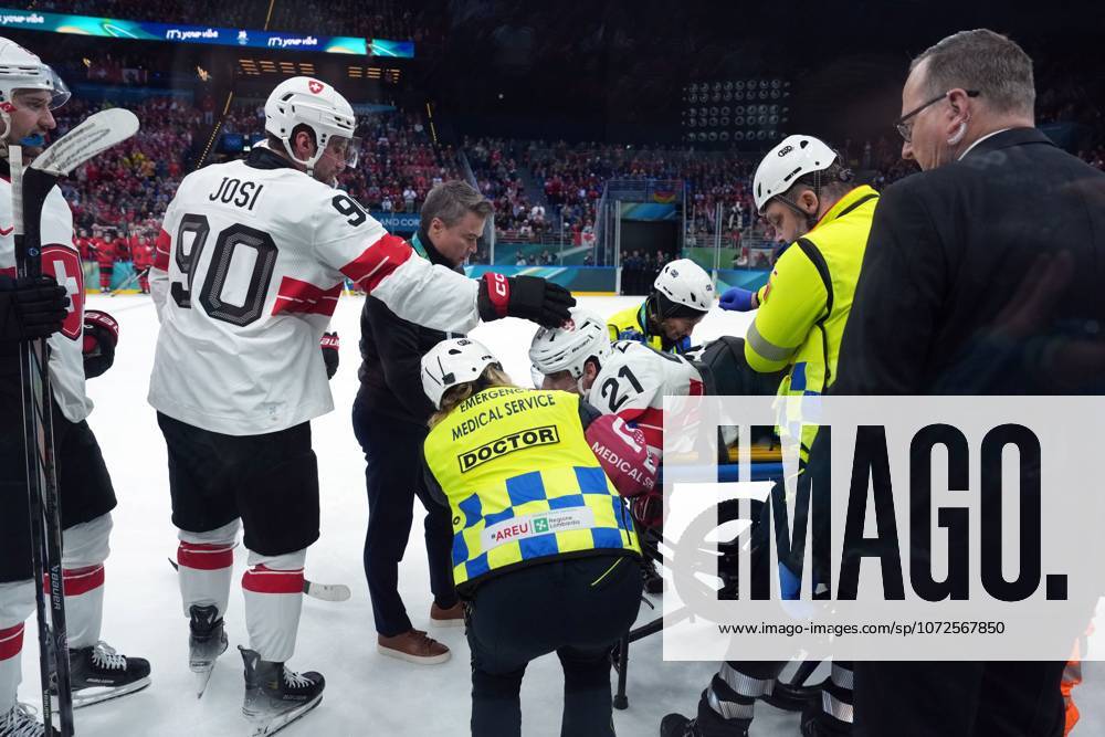 Switzerland s Roman Josi (90) checks on Kevin Fiala (21) who is tended to after an injury against Canada during the third period of a preliminary round men s hockey game at the 2026 Winter Olympics, in Milan, on Friday, Feb. 13, 2026. Canada News - February 13, 2026 - ZUMAc35_ 20260213_zaf_c35_130