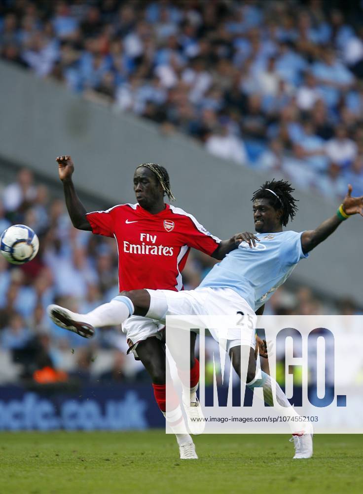 Manchester City V Arsenal, Premier League Bacary Sagna of Arsenal and Emmanuel Adebayor of Manchester City challenge during the Premier League match between Manchester City and Arsenal at City Of Manchester Stadium on September 12, 2009 in Manchester, England. Manchester City Of Manchester Stadium England United Kingdom