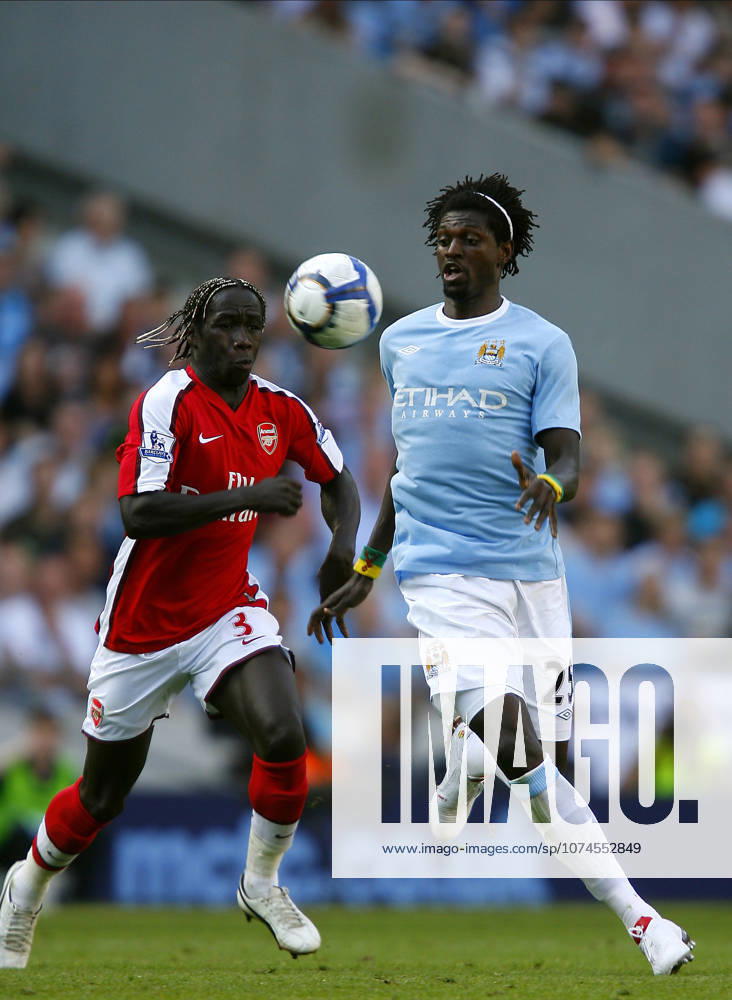 Manchester City V Arsenal, Premier League Bacary Sagna of Arsenal and Emmanuel Adebayor of Manchester City on the ball during the Premier League match between Manchester City and Arsenal at City Of Manchester Stadium on September 12, 2009 in Manchester, England. Manchester City Of Manchester Stadium England United Kingdom