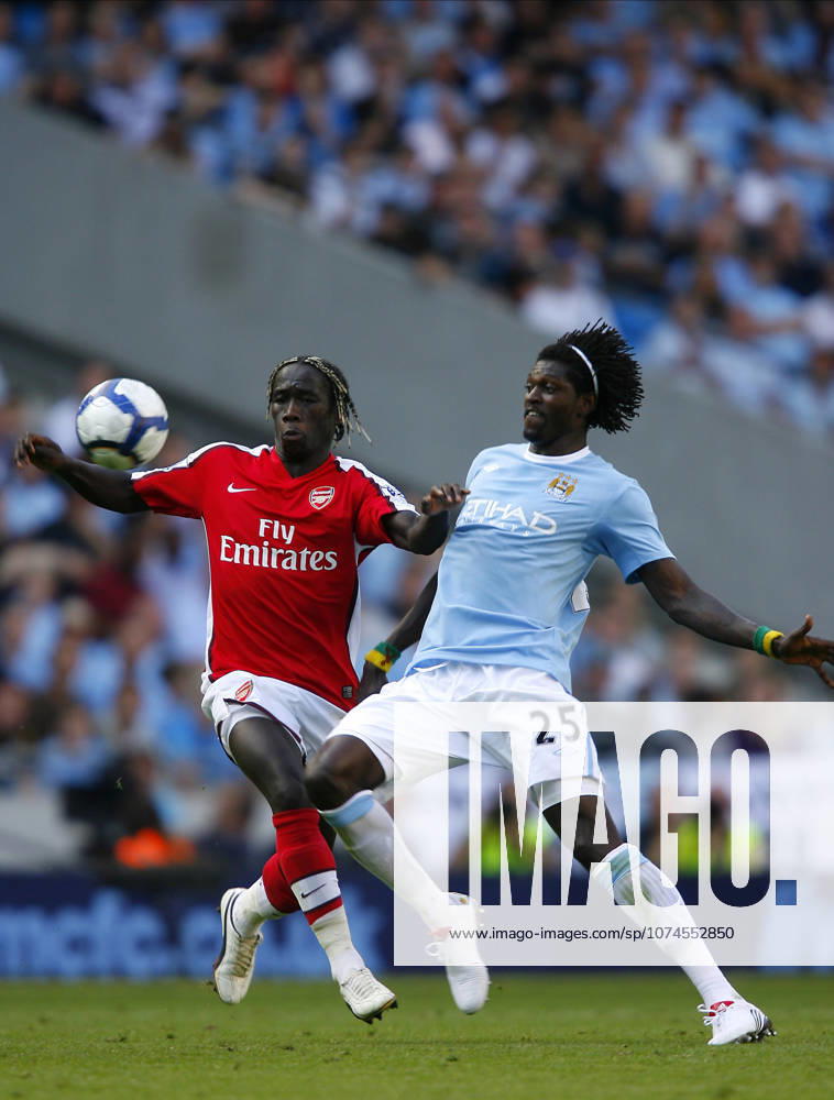 Manchester City V Arsenal, Premier League Bacary Sagna of Arsenal and Emmanuel Adebayor of Manchester City on the ball during the Premier League match between Manchester City and Arsenal at City Of Manchester Stadium on September 12, 2009 in Manchester, England. Manchester City Of Manchester Stadium England United Kingdom