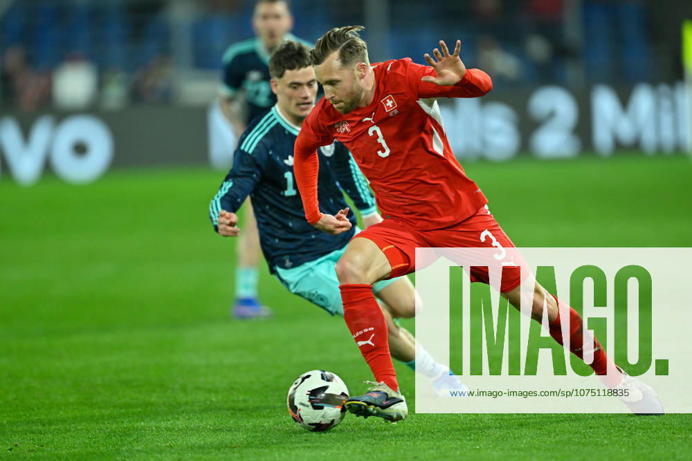 Basel, St.Jakob-Park, 27.03.26, GER, Herren, Laenderspiel: Schweiz - Deutschland Bild: v.li. im Zweikampf Florian WIRTZ (Deutschland) und Silvan WIDMER (Schweiz) UEFA regulations prohibit any use of photographs as image sequences and or quasi-video. Basel Schweiz