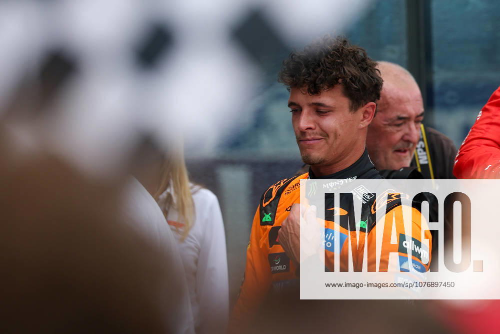 2nd May 2026; Miami International Autodrome, Miami, Florida, United States of America; 2026 FIA Formula 1 Miami Grand Prix; Sprint Race; Lando Norris (1) of Great Britain and McLaren Mastercard F1 Team after winning the Sprint Race with a fan waiving a checkered flag in the foreground DavidxBuono