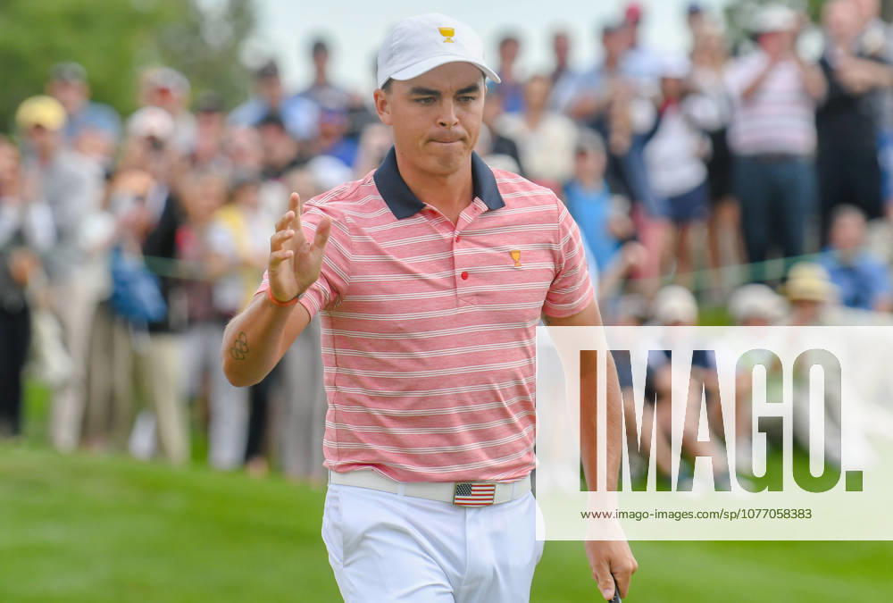 Rickie Fowler of the United States acknowledges the crowd after sinking a putt on the 3rd hole during the second round of the Presidents Cup at Liberty National Golf Course in Jersey City, New Jersey. Gregory Vasil CSM
