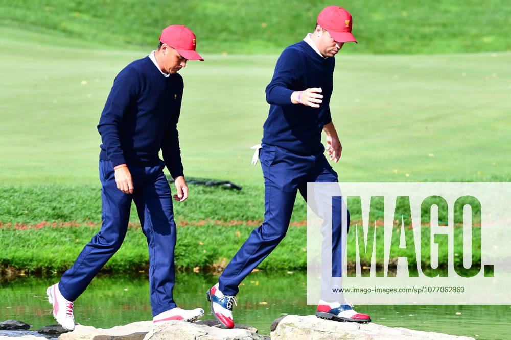 Jersey City, New Jersey, U.S - Rickie Fowler of the US Team(left)j and Justin Thomas of the US Team(right) walk across the stone bridge after the 12th hole during Saturday matches of the Presidents Cup at Liberty National Golf Club in Jersey City, NJ
