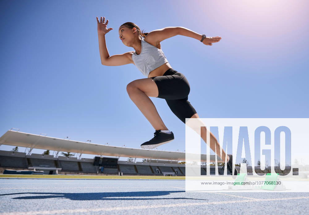 Woman runner, running and training on track, workout and exercise for race, marathon and in stadium. Speed, sports and fitness athlete with cardio, sprinter and fast run for Olympics event. (License=RF) 19962291 ,model released, Symbolfoto
