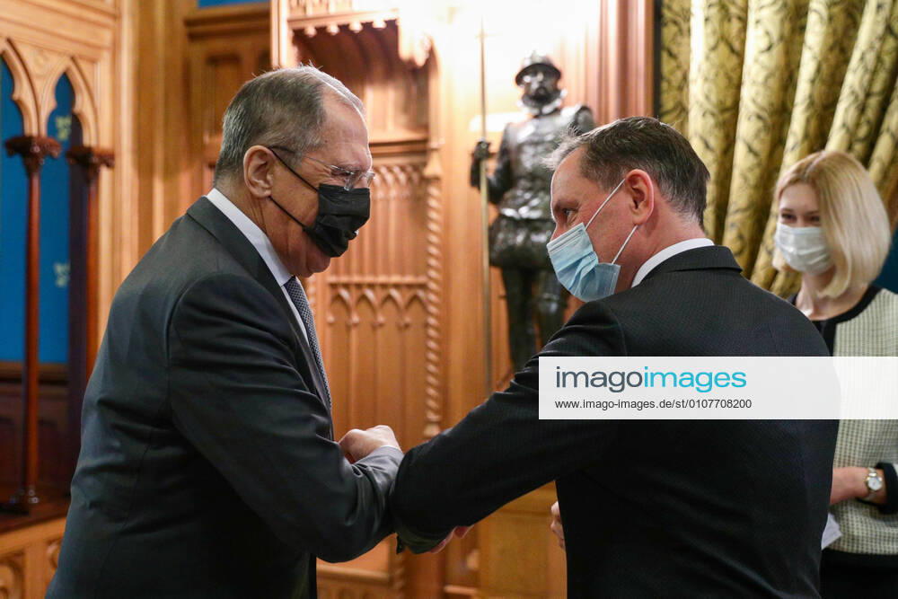 Russia s Minister of Foreign Affairs Sergei Lavrov (L) and a co-leader of the Alternative For Germany (AfD) Party, Tino Chrupalla (R), use an elbow bump greeting during a meeting at the Russian Foreign Ministry s Reception House at Spiridonovka Street. Russian Ministry of Foreign Affairs TASS TS0F0D52