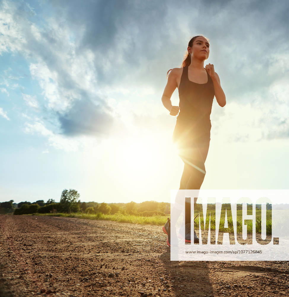 Energy and persistence win the race. a fit young woman out for a run on a beautiful day (License=RF) 20123195 ,model released, Symbolfoto