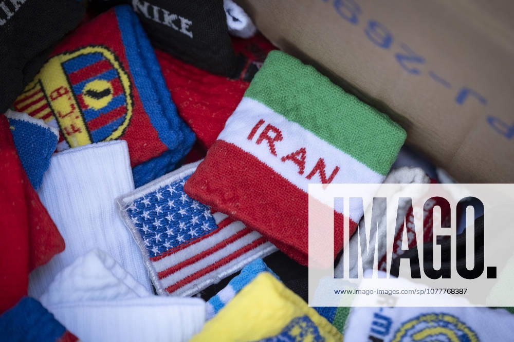 Iran-World Cup 2026 Wristbands with flags of the United States and Iran are pictured in a box on a sidewalk in downtown Tehran, Iran, on May 22, 2026. The 2026 FIFA World Cup, WM, Weltmeisterschaft, Fussball scheduled from June 11 to July 19, will be hosted for the first time in history by three nations: the United States, Canada, and Mexico. Tehran Tehran Iran