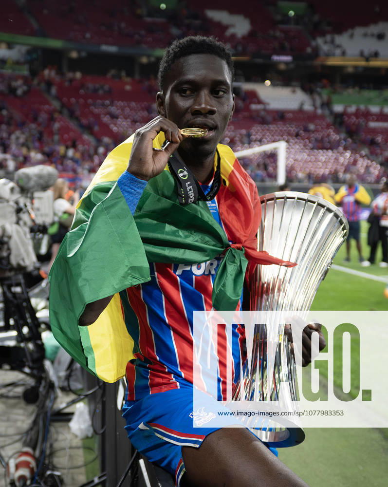 . - Crystal Palace v Rayo Vallecano, UEFA Conference League Final 2026, Red Bull Arena, Leipzig, Germany, 27th May 2026. Daniel Weir Crystal Pix Ismaila Sarr of Crystal Palace biting his UEFA Conference League 2026 Winners Medal and holding the Conference League Trophy. - Crystal Palace v Rayo Vallecano, UEFA Conference League Final 2026, Red Bull Arena, Leipzig, Germany, 27th May 2026. Daniel Weir Crystal Pix Leipzig Red Bull Arena Germany