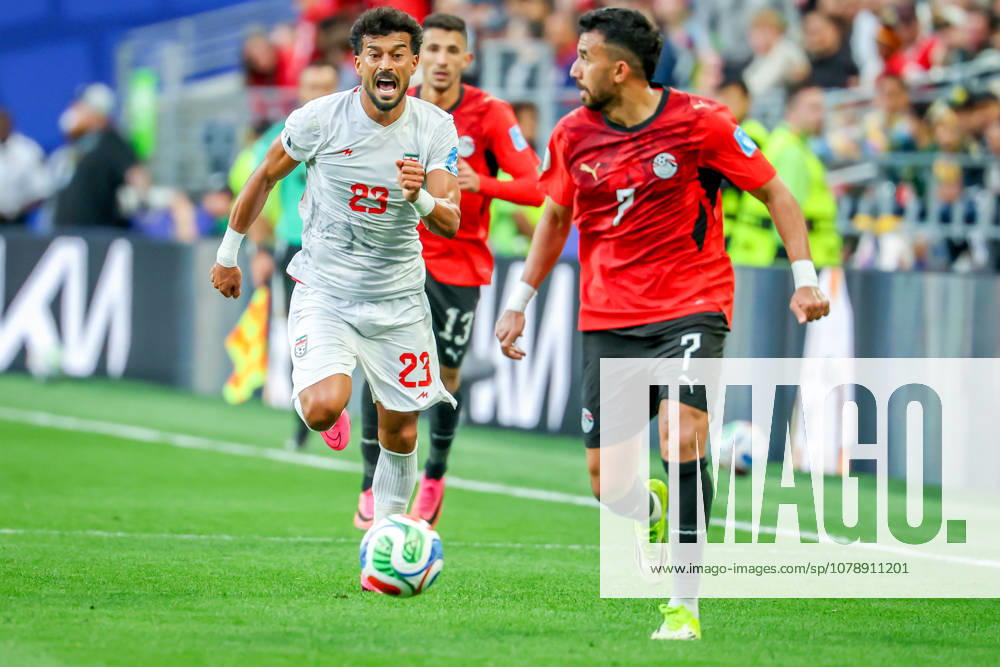Iran defender Ramin Rezaeian (23) and Egypt midfielder Mahmoud Hassan Tro zo guet (7) during the match between Egypt and Iran in the World Cup 2026 at Seattle Stadium, Seattle, Washington Egypt And Iran - ZUMAj111 20260626_zsp_j111_046
