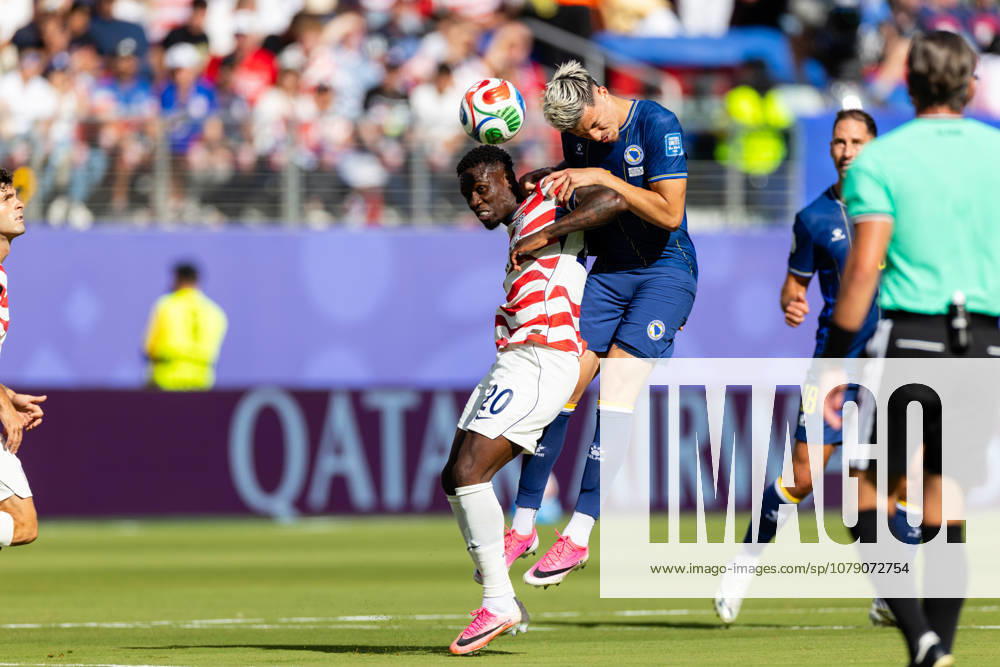 SANTA CLARA, CA - JULY 01: Tarik Muharemovic 4 of Bosnia and Herzegovina heads the ball against Folarin Balogun 20 of United States of America during the FIFA World Cup, WM, Weltmeisterschaft, Fussball 2026 Round of 32 match between United States of America and Bosnia and Herzegovina on July 1, 2026 at San Francisco Bay Area Stadium in Santa Clara, CA. (Photo by Matthew Huang Icon Sportswire) SOCCER: JUL 01 FIFA World Cup 26 Round of 32 - USA v Bosnia and Herzegovina Icon260701013