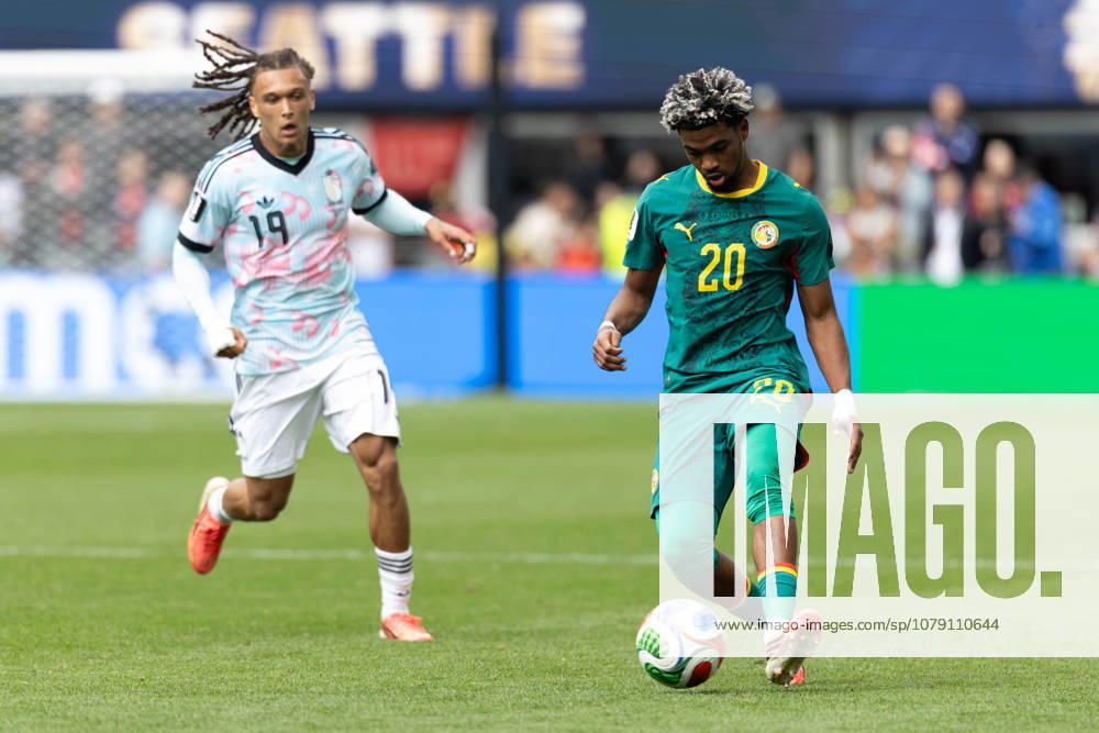 Senegal forward Ibrahim Mbaye (20) runs with ball by Belgium midfielder Diego Moreira (19) in overtime of the game Belgium national team, Nationalteam vs Senegal National Team for the FIFA World Cup, WM, Weltmeisterschaft, Fussball match, at Seattle Stadium. Seattle USA - ZUMAl181 20260701_zsp_l181_102