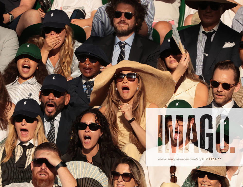 American actress Jennifer Lopez (C) and British actor Tom Hiddleston watch the Men s Wimbledon Singles final on day Fourteen of the 2026 Wimbledon Championships in London on Sunday, July 12,2026. Sinner won the match 6-7 7-6 6-3 6-4. LON2026071294 HUGOxPHILPOTT