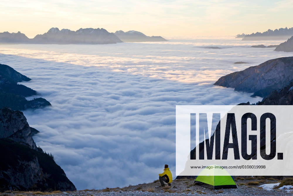 Man and tent above the clouds, Trentino-Alto Adige, South Tyrol in Bolzano district, Alta Pusteria, Hochpustertal,Sexten Dolomites, Italy Man and tent above the clouds, Trentino-Alto Adige, South Tyrol in Bolzano district, Alta Pusteria, Hochpustertal,Sexten Dolomites, Italy Man and tent above the clouds, Trentino-Alto Adige, South Tyrol in Bolzano district, Alta Pusteria, Hochpustertal,Sexten Dolomites, Italy