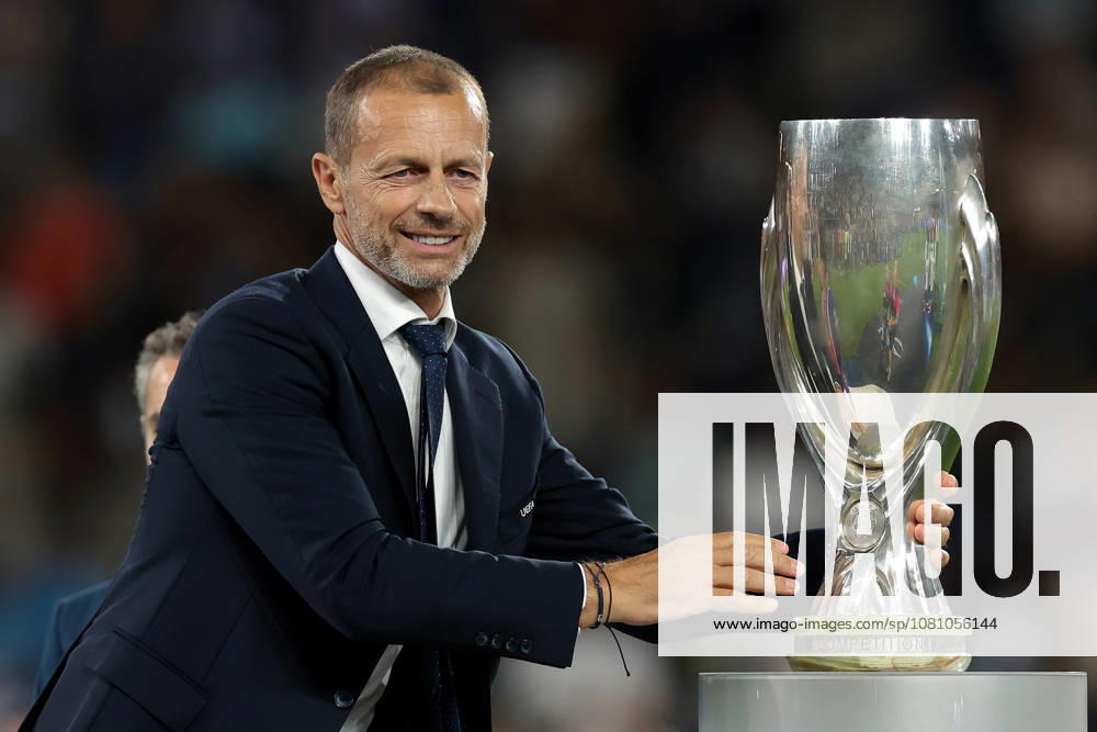 Paris Saint Germain v Aston Villa - UEFA Super Cup - Stadion Salzburg Salzburg, Austria, 12th August 2026. UEFA President Aleksander Ceferin reaches for the UEFA Supercup to present to Marquinhos of PSG following the Paris Saint Germain vs Aston Villa UEFA Super Cup match at Stadion Salzburg, Salzburg. Picture credit should read: Jonathan Moscrop Salzburg Stadion Salzburg Austria