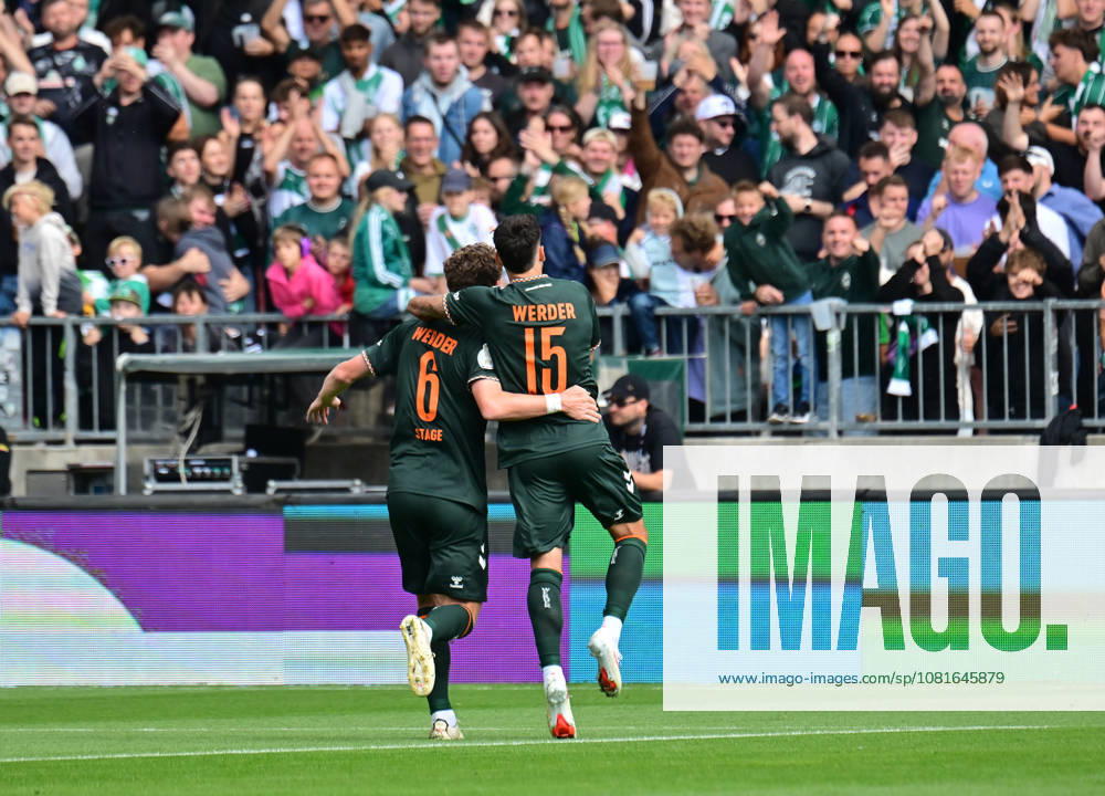 GER Fußball, Männer,DFB Pokal, 1.Runde Saison 2026 2027, Hamburg, Lüneburger SK vs Werder Bremen Jens Stage (Werder 06) schiesst das Tor zum 1-0 fuer Bremen vorbei an Torwart Tommy Henze (Pauli 01) und jubelt mit den Fans DFB DFL regulations prohibit any use of photographs as image sequences and or quasi-video) Hamburg Millerntorstadion Hamburg Deutschland