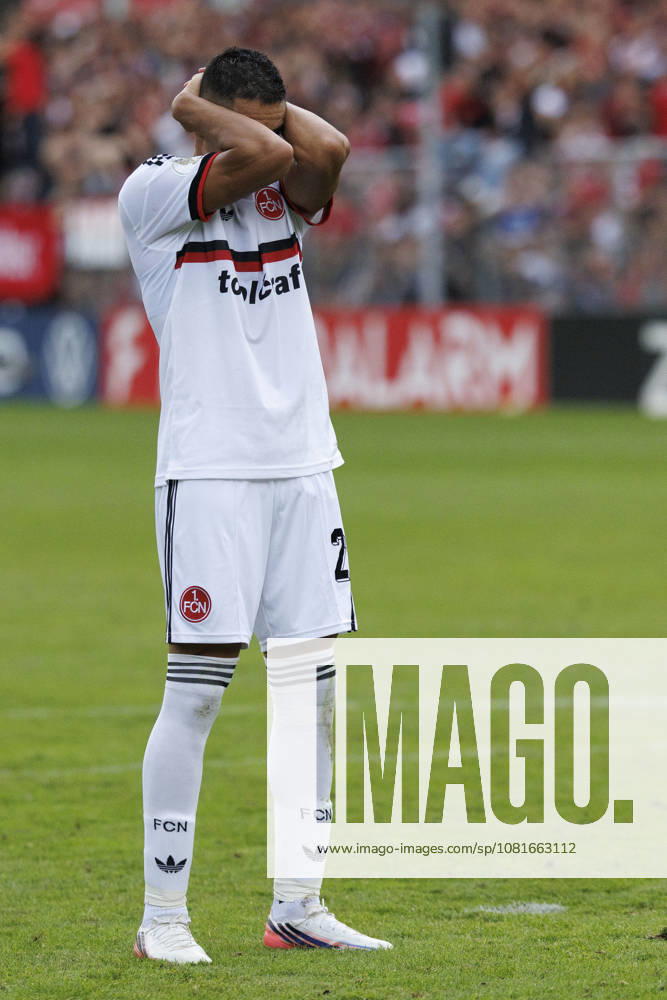 Giannis Masouras (1. FC Nuernberg, 21) gestures after failing a penalty during the shootout during the DFB-Cup match between Viktoria Koeln vs. 1. FC Nuernberg at the Sportpark Hoehenberg on August 22, 2026 in Koeln, Germany. DFL REGULATIONS PROHIBIT ANY USE OF PHOTOGRAPHS AS IMAGE SEQUENCES AND OR QUASI-VIDEO. Nordrhein-Westfalen Germany